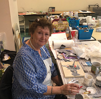 artist working on collage