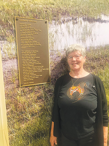 Lynn M. Hansen with poem plaque