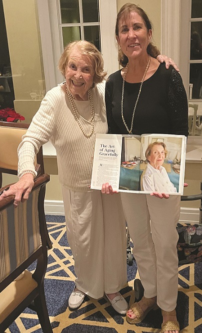 Marcy Von Kohorn holds the magazine article with her daughter-in-law