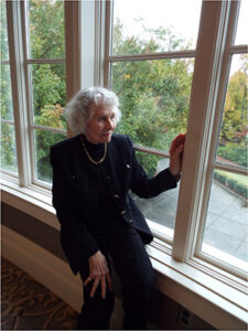 Polly Craig sitting by a window