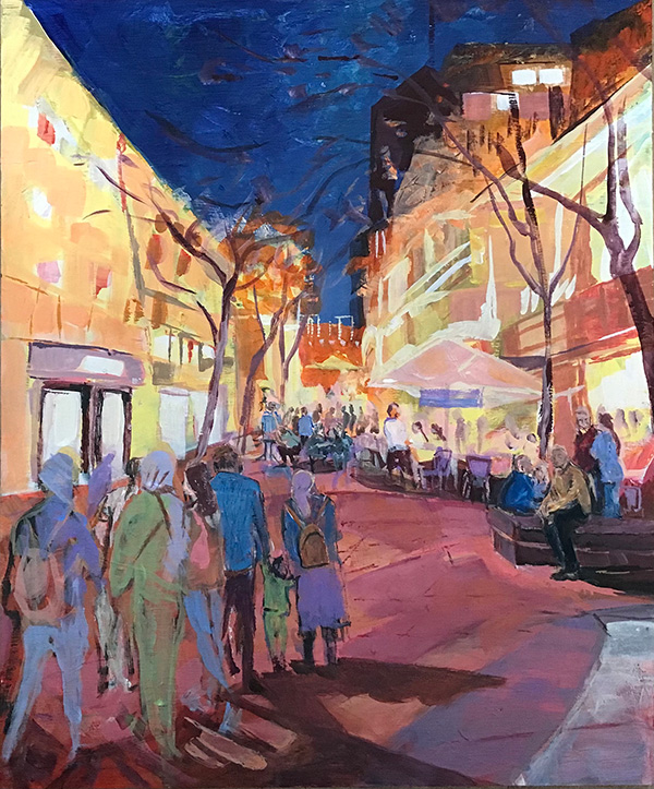 Outdoor scene of pedestrians on a street with a mall