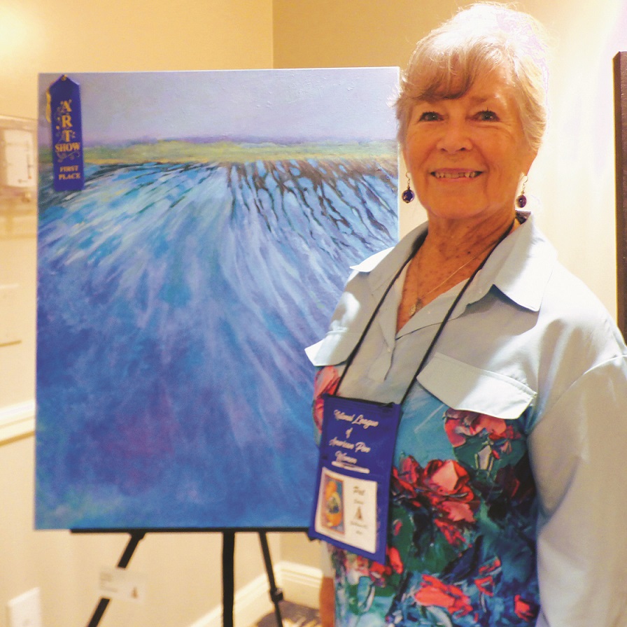 Pat Setser in front of her painting Beckoning