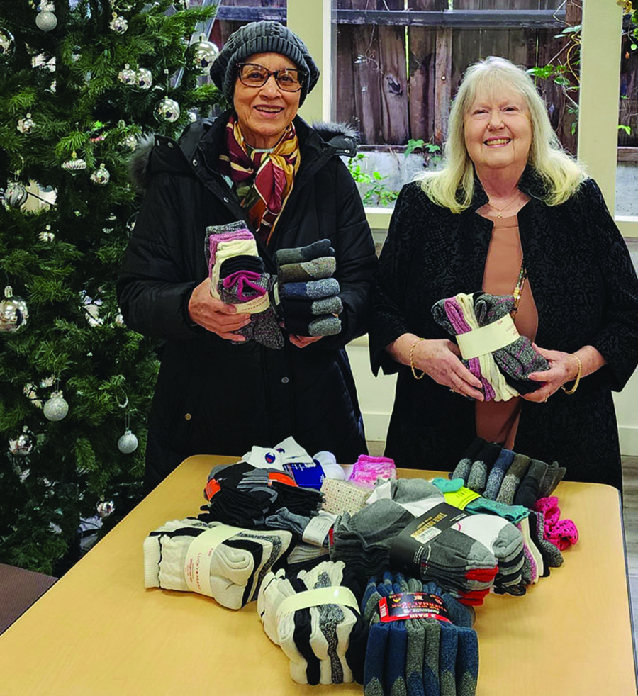 Branch Outreach Chair Dorothy Atkins and President Luanna Leisure with some of the sock collection